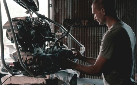 Mechanic diagnosing European vehicle parts